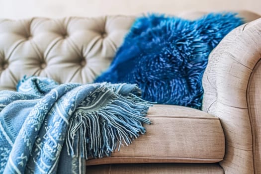 A couch adorned with a soft blanket, inviting relaxation and comfort in a peaceful space.