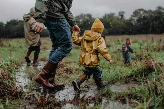 A man and child navigate a muddy field, their footsteps leaving imprints in the soft earth as they journey together through the serene landscape.