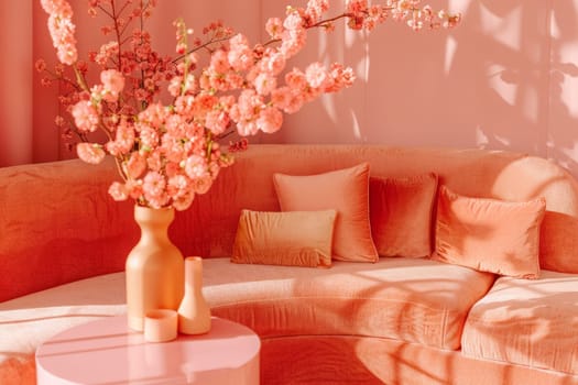 A colorful vase of flowers adorned the table beside the cozy couch, adding a touch of nature to the room.