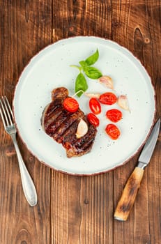 Juicy meat classic grilled steak, beef steak. BBQ, roasted meat.