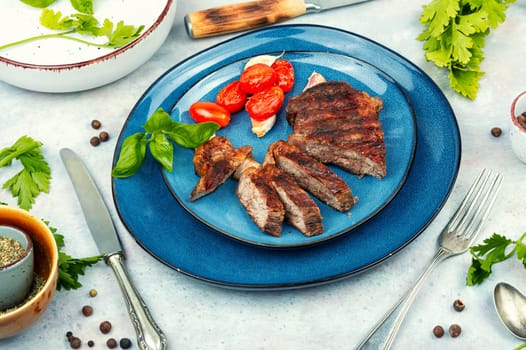 Juicy meat classic grilled steak, beef steak. BBQ, roasted meat.