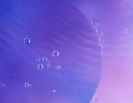 Colorful abstract macro background with oil drops in water