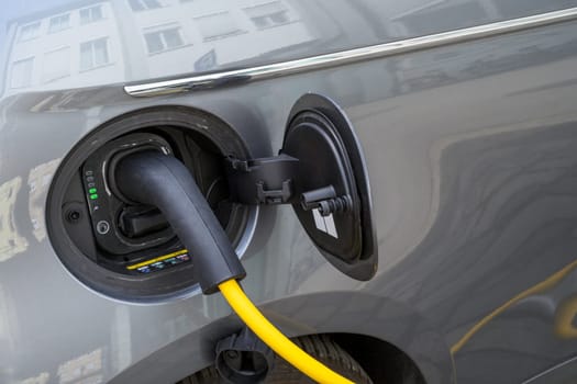 Recharging of an an electric car with a plug and cable