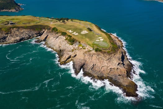Top view of golf court by the sea
