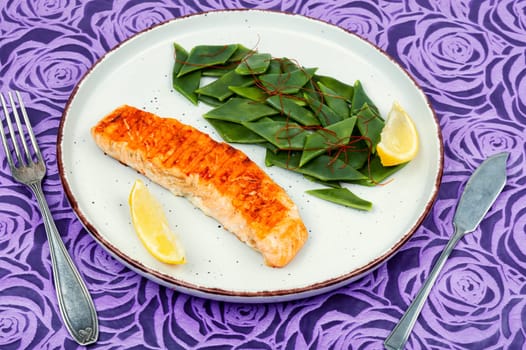Salmon steak or trout with green bean. Ketogenic.