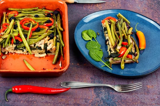 Vegetable pie with green or bush beans and peppers. Delicious snack. Top view.