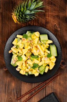 Vegan fresh pineapple and cucumber salad. Pineapple salad.