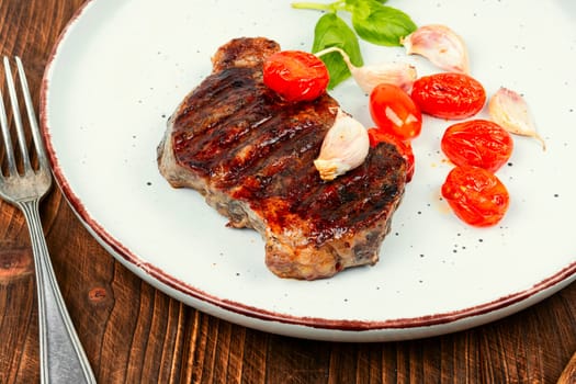 Juicy meat classic grilled steak, beef steak. BBQ, roasted meat.