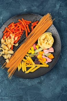 A set of dry macaroni, uncooked pasta and spaghetti. Italian food concept.