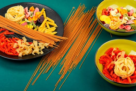 A set of dry macaroni, uncooked pasta and spaghetti. Italian food concept.