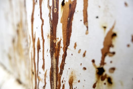 Detail of old metal wall damaged by time, ruin