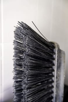 Detail of old dirty and damaged sweeping broom