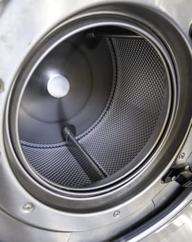 Interior detail of industrial washing machine, hygiene and cleaning