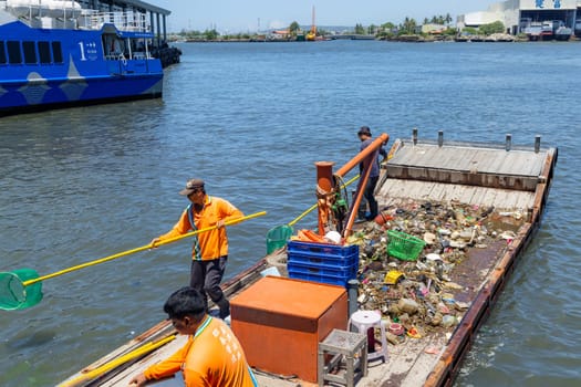 Taiwan 25 August 2022: Collect the trash on the ship over the sea
