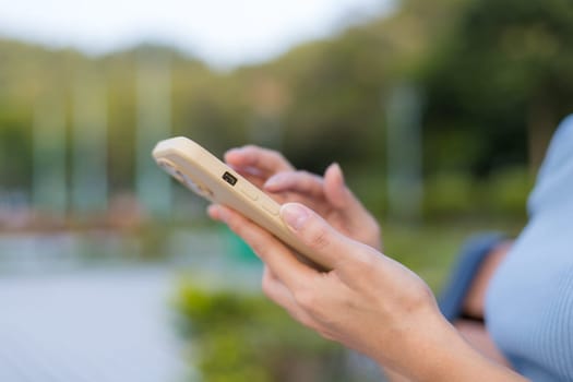 Woman use mobile phone at outdoor