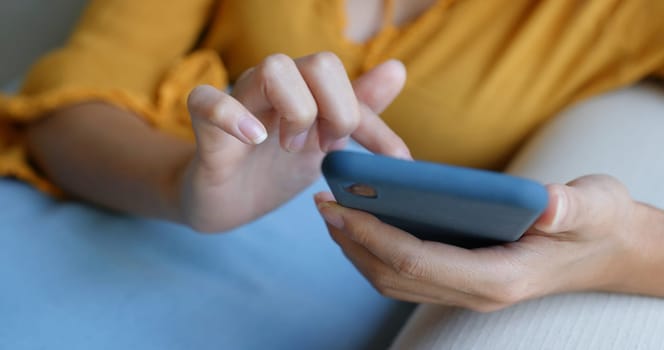 Woman use of mobile phone at home