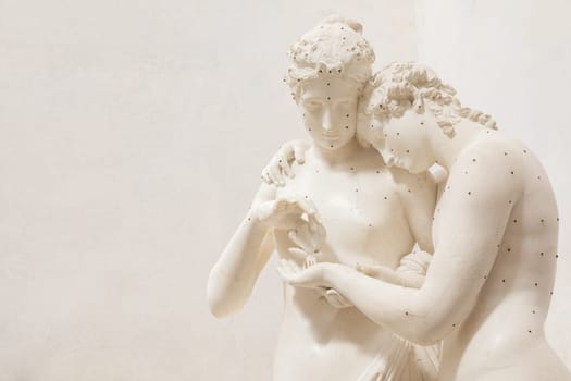 Possagno, Italy - 29 June 2023: Cupid and Psyche statue by sculptor Antonio Canova, 1800. Sensual hug, love and togetherness emotion.