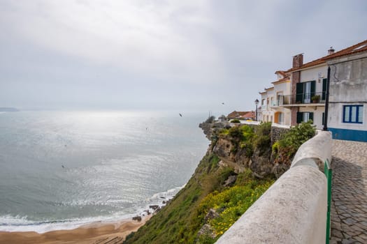 Upper part of the town of Nazaré and view over the Atlantic ocean in Portugal, copy space