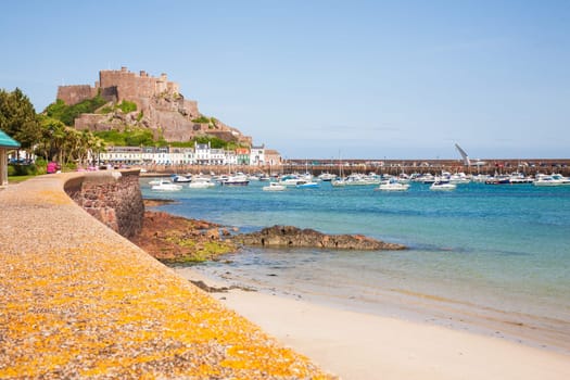 Gorey, Jersey - May 15 2011: Gorey harbour and Mont Orgueil Castle, Jersey, in The Channel Islands