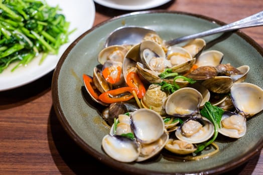 Fry clam with basil in restaurant