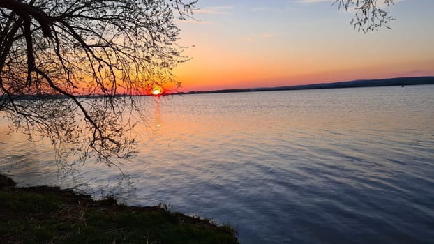 Beautiful sunset at the lake with a motorhome on a camping holiday in Sweden