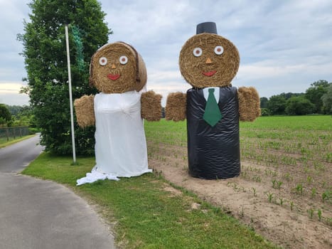 Scarecrow straw figures farmers and farmer's wife