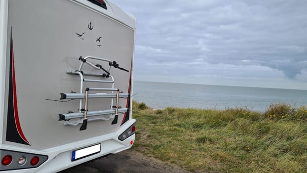 Man standing near motorhome getting ready to travel for family vacation travel, vacation trip in motorhome motorhome, caravan vacation.