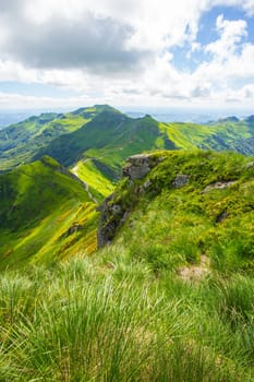 Panoramic landscape of volcanic mountains (vertical view from Puy Mary, Massif Central, France). Photography taken in France