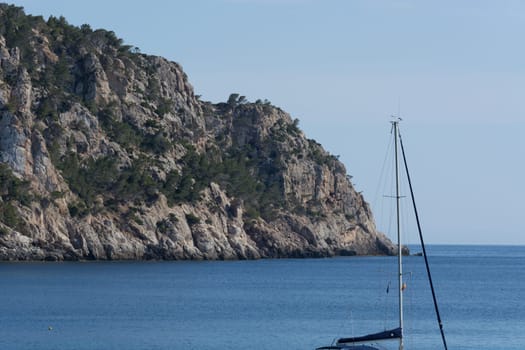 Small rocks in the blue Mediterranean Sea on Majorca's coast.