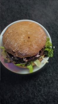 Masterpiece from the grill: Juicy hamburger with fresh ingredients