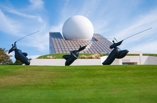 Poitiers, France - September 18 2010 : The Futuroscope pavilion, symbol of the park, is the very first, inaugurated in 1987. Sculptures from Jean-Louis Toutain.