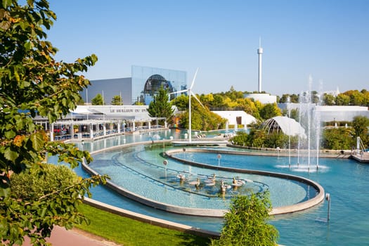 Poitiers, France - September 22 2010: Pool and fountains in front of IMAX Cinema pavilion in Futuroscope theme park
