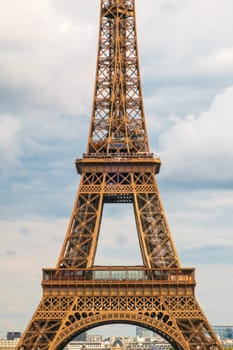 Paris, France - August 29 2023: The Eiffel tower seen from Trocadero in a cloudy day. Vertical photography taken in Paris