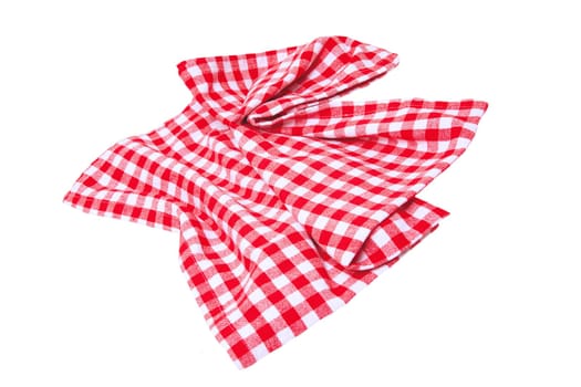 Closeup of a red and white checkered napkin or tablecloth texture isolated on white background. Kitchen accessories. Top view.