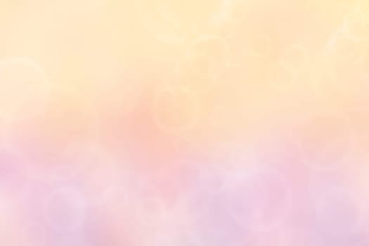 Abstract blurred vivid spring summer light delicate pastel blue orange yellow bokeh background texture with bright soft color circles. Card concept. Beautiful backdrop illustration.