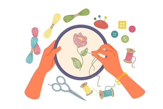 Hand embroidery and creative needlework using stretched canvas and needles with multi-colored threads. Woman embroiders wildflower while being keen on needlework and producing handmade goods