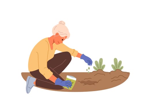 Elderly woman plants seeds in ground, planting flowers in garden or backyard of house. Old lady with seeds gets involved in vegetable gardening as hobby or saving money by getting fresh organic food