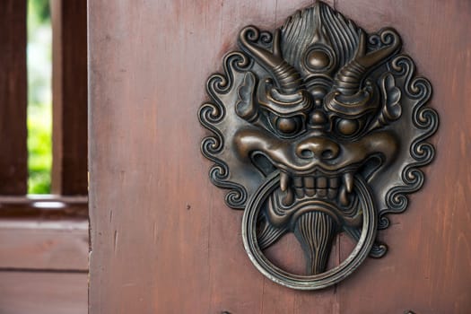 Lion head door handle in Chinese temple