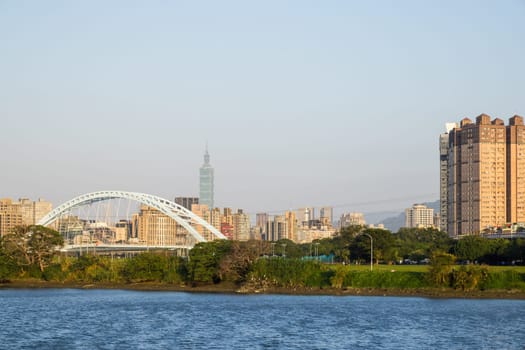 Taipei, Taiwan 07 December 2023: Taipei city downtown with river view at evening time