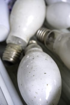 Detail of old damaged and discarded light bulbs, recycling