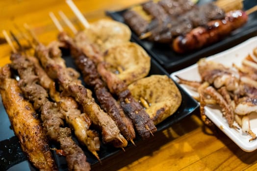 Variety of meat skewers on dish