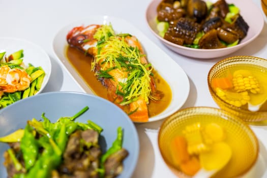 Chinese family dinner together with asian cuisine food