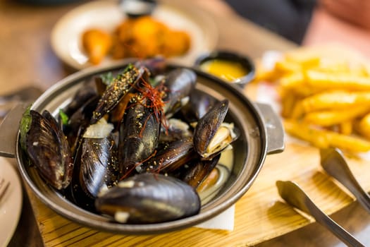 Delicious mussels with herb and sauce