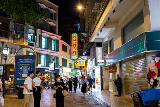 Macau 28 June 2023: Souvenir shop street in Macau city at night
