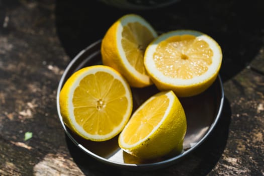 Fresh lemons arranged neatly on a rustic wooden table, ready to be used for refreshing lemonade or zesty recipes.