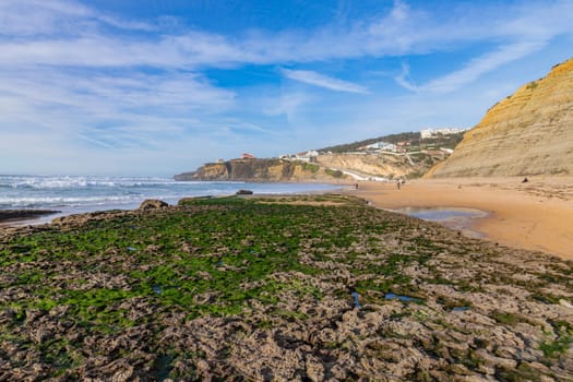 Sintra, Portugal: February 17, 2024: People at the beach of Magoito in a winter day, Sintra, Portugal