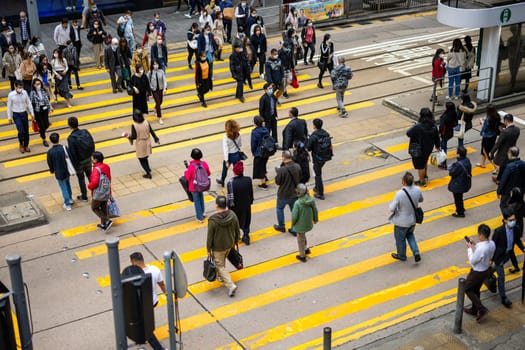 Hong Kong 12 January 2023: Top view of the people cross the road in Hong Kong city