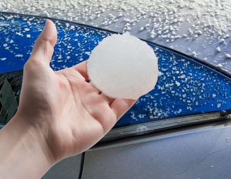 Hail damage to the car. Damaged hood and windshield
