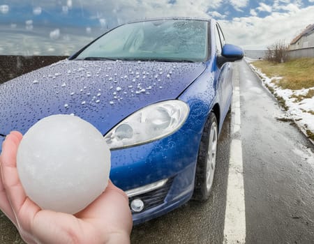 Hail damage to the car. Damaged hood and windshield