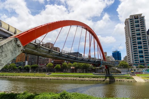 Taipei, Taiwan 25 July 2023: Red bridge over the river in Taipei city